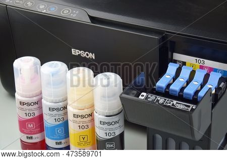 Four Bottles Of Ink Epson, Yellow, Red, Blue, Black, Built-in To The Epson L3150 Series Printer.