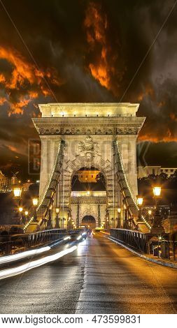 Amazing Night Scene With Traffic On Széchenyi Chain Bridge Over Danube River. Location: Budapest Cit