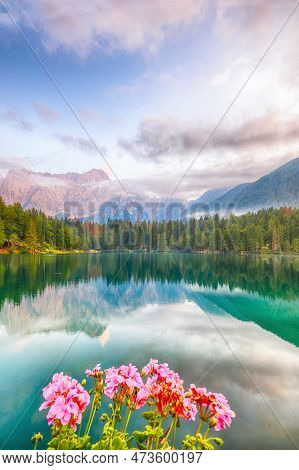 Incredible View Of Sunset Over Fusine Lake With Mangart Peak On Background. Popular Travel Destinati