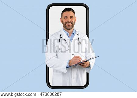 Telemedicine, Appointment With Doc Online. Friendly Middle Aged Doctor With Clipboard At Huge Smartp