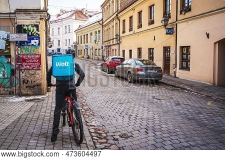 Wolt Courier On Bicycle. Wolt Is A Food Delivery Service. Vilnius, Lithuania - March 10, 2023.