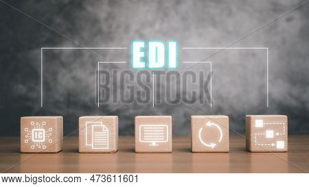 Edi-electronic Data Interchange Concept, Wooden Cube Block With Virtual Screen Edi Icon On Wooden De