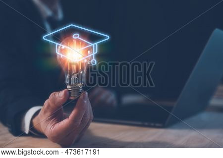 Graduated Concept, Virtual Graduation Hat On Top Of Light Bulb On Businessman Hand, Congratulation D