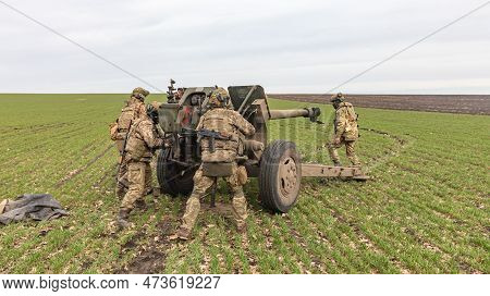 Donetsk Reg, Ukraine - Mar. 21, 2023: A Ukrainian Soldier Is Seen Preparing To Fire The 122 Mm D-30 