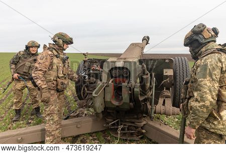 Donetsk Reg, Ukraine - Mar. 21, 2023: An Artillery Crew Is Seen Preparing A 122mm Howitzer D-30 For 