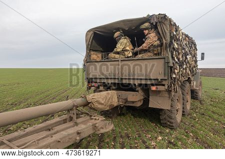 Donetsk Reg, Ukraine - Mar. 21, 2023: The Artillery Crew Leaves The Firing Position And Moves To A N