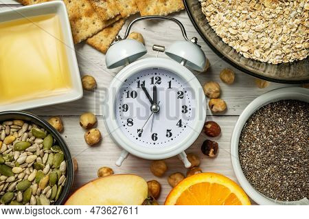 Diet Time. Food Clock. Healthy Eating With Oat Flakes, Hazelnuts, Chia Seeds, Pumpkin Seeds, Sunflow