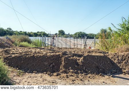 Kanoneiland, South Africa - Feb 25, 2023: The Eendrag Bridge Over The Flooded Orange River At Kanone