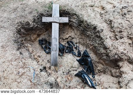 Crosses Are Seen At A Forest Grave Site After An Exhumation In The Town Of Izium, Recently Liberated