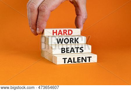 Hard Work Beats Talent Symbol. Concept Words Hard Work Beats Talent On Wooden Block. Beautiful Orang