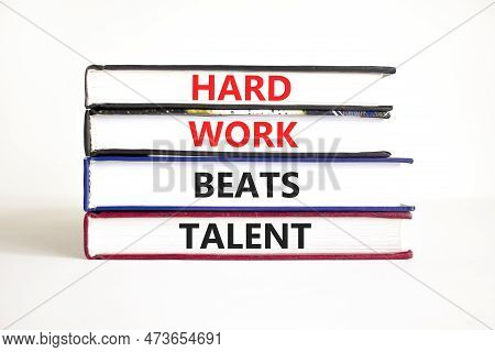 Hard Work Beats Talent Symbol. Concept Words Hard Work Beats Talent On Books. Beautiful White Table 