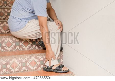 Man Hand Massage Physiotherapy Leg Is Sore And Numb, Exhausted, Tingling. Guillain-barre Syndrome, A