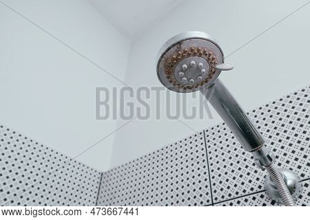Silver Shower Head With Limescales. Shower Damaged From Water Scale. Hard Water Deposit All Around T