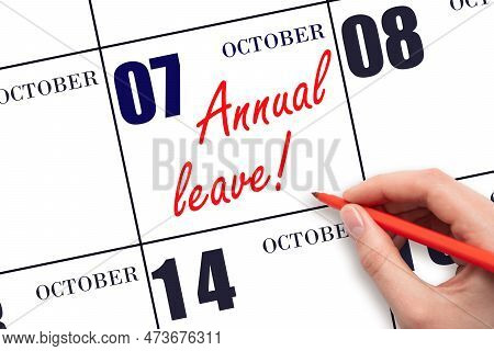 7th Day Of October. Hand Writing The Text Annual Leave And Drawing The Sun On The Calendar Date Octo