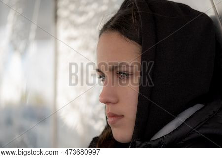 Close-up Portrait Of An Attractive Young Girl, Framed In Profile, With Green Eyes And Dark Hair. Tee