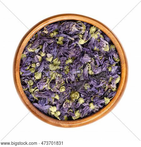 Dried Purple Mallow Tea Flowers, In A Wooden Bowl. Mauve-purple Flower Heads Of Malva Sylvestris, Al