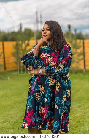 Portrait Of Beautiful African American Woman Having Fun On Village Or Suburbian. Outdoor Portrait Of