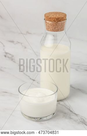 A Bottle Of Milk And Glass Of Yogurt, Kefir, Fermented Milk, Probiotic Cold Fermented Dairy Drink. T