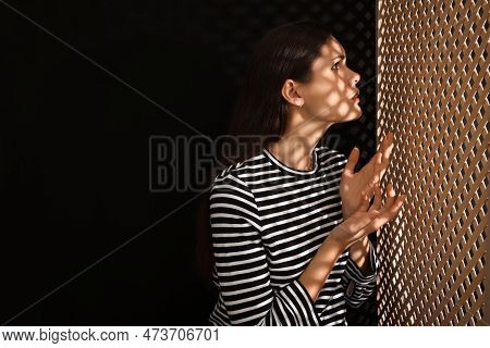 Woman Talking To Priest During Confession Near Wooden Partition In Booth, Space For Text