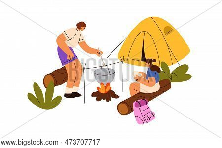 Campers Cooking On Fire Outdoor At Camp. Tourists Eating, Relaxing At Campfire, Campground On Summer