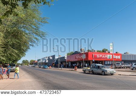 Keimoes, South Africa - Feb 25, 2023: A Street Scene, With Businesses, People And Vehicles, In Keimo