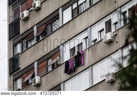 Picture Of Clothing Drying And Hanging On Windows Of A Communist Building In The Streets Of Belgrade