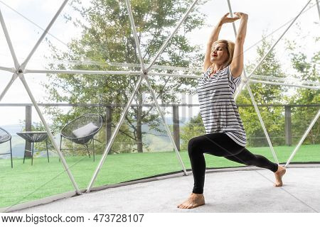 Woman Doing Yoga Glamping House . Healthy Lifestyle Concept. Weekend Getaway At Glamping. Mental Hea
