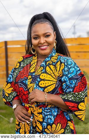 Portrait Of Beautiful African American Woman Having Fun On Village Or Suburbian. Outdoor Portrait Of