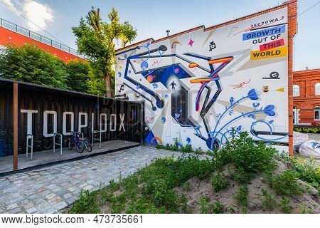 Wroclaw, Poland - June 2022: A Large And Colorful Tooploox Advertising Mural On The Wall Of A Red Br