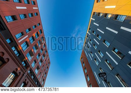 Wroclaw, Poland - June 2022: Facades Of Two Modern Apartment Buildings With Brick And Concrete Facad