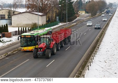 Poznan, Poland - January 24, 2023: Car Traffic On A Motorway In Poland. A Bus And A Tractor Are Driv