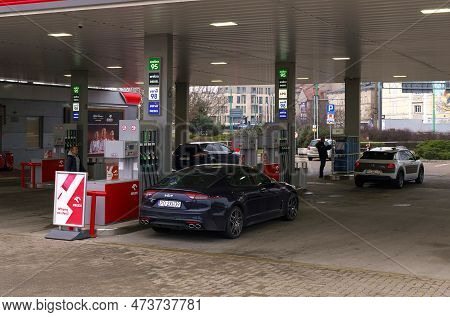 Poznan, Poland - February 11, 2023: Refueling Cars At A Gas Station In The City.