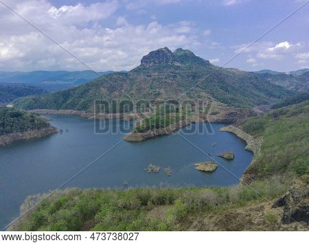 Aerial View Of Lake Against The Hills