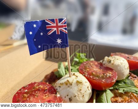 Small Flags Of Australia In The Box With Pizza, Cherry Tomatoes And Cheese