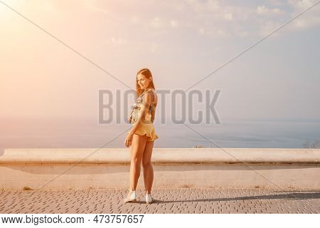 Woman Summer Dance. Silhouette Of A Happy Woman Who Dances, Spins And Raises Her Hands To The Sky. A