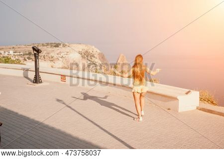 Woman Summer Dance. Silhouette Of A Happy Woman Who Dances, Spins And Raises Her Hands To The Sky. A