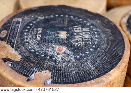 Cremona, Italy - September 7, 2022: Whole Wheels Of Monte Veronese Cheese Sold At A Street Stall Dur