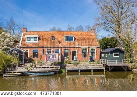 Boats At The Jetty Of Little House In Onderdendam, Netherlands