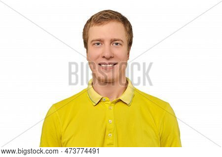 Portrait Of Funny Young Male In Yellow T-shirt Isolated On White Background. Attractive Smiling Man 