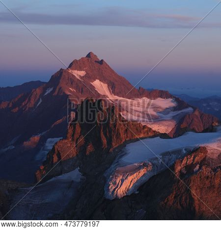 High Mountain In Purple Evening Light, View From Mount Titlis, Switzerland.