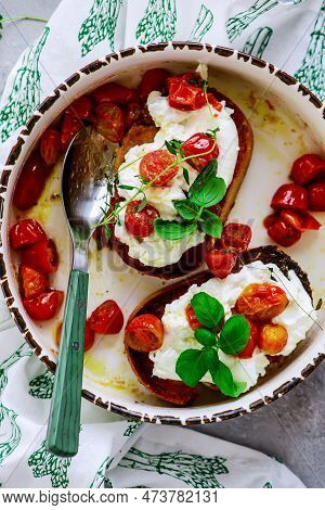 Bruschetta With Buratta And Baked Cherry Tomatoes.top View.selective Focus