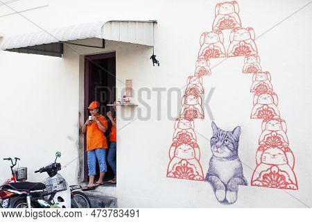 Georgetown, Penang, Malaysia - September 03, 2014: Women Resting At The Shop Entrance At One Of The 