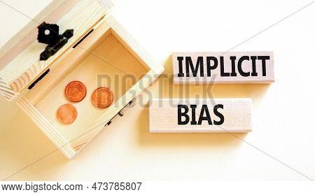 Implicit Bias Symbol. Concept Words Implicit Bias On Wooden Block. Beautiful White Table White Backg