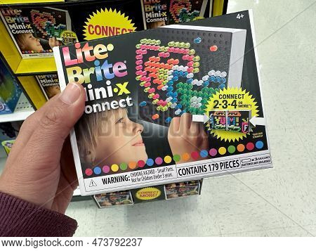 Plymouth, Minnesota - March 27, 2023: Hand Holds A Lite Brite Mini X Connect Toy For Children At A T