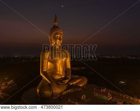 Scenery Sunset Behind The Great Golden Buddha Landmark Of Thailand At Wat Muang Ang Thong Thailand. 