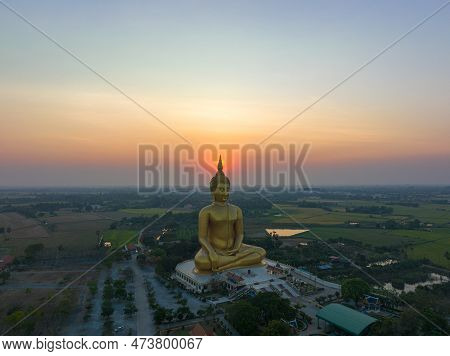 Scenery Sunset Behind The Great Golden Buddha Landmark Of Thailand At Wat Muang Ang Thong Thailand. 