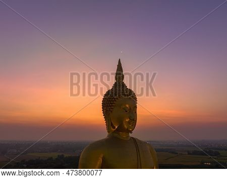 Scenery Sunset Behind The Great Golden Buddha Landmark Of Thailand At Wat Muang Ang Thong Thailand. 