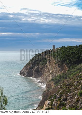 View Of The Cliff In The Sierra De Irta With The Badum Tower Of Peñíscola