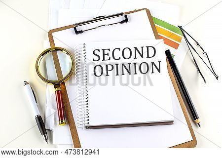 Second Opinion Text On A Notebook With Clipboard On White Background