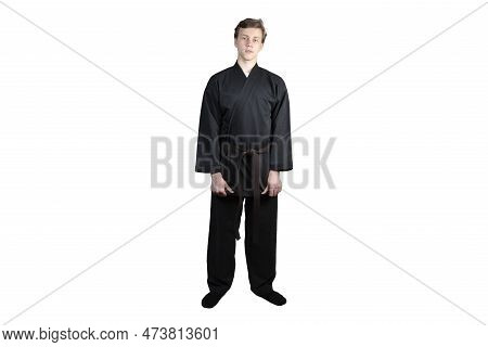 Taekwando.a Teenager In A Black Kimano Who Is Engaged In Taekwando.